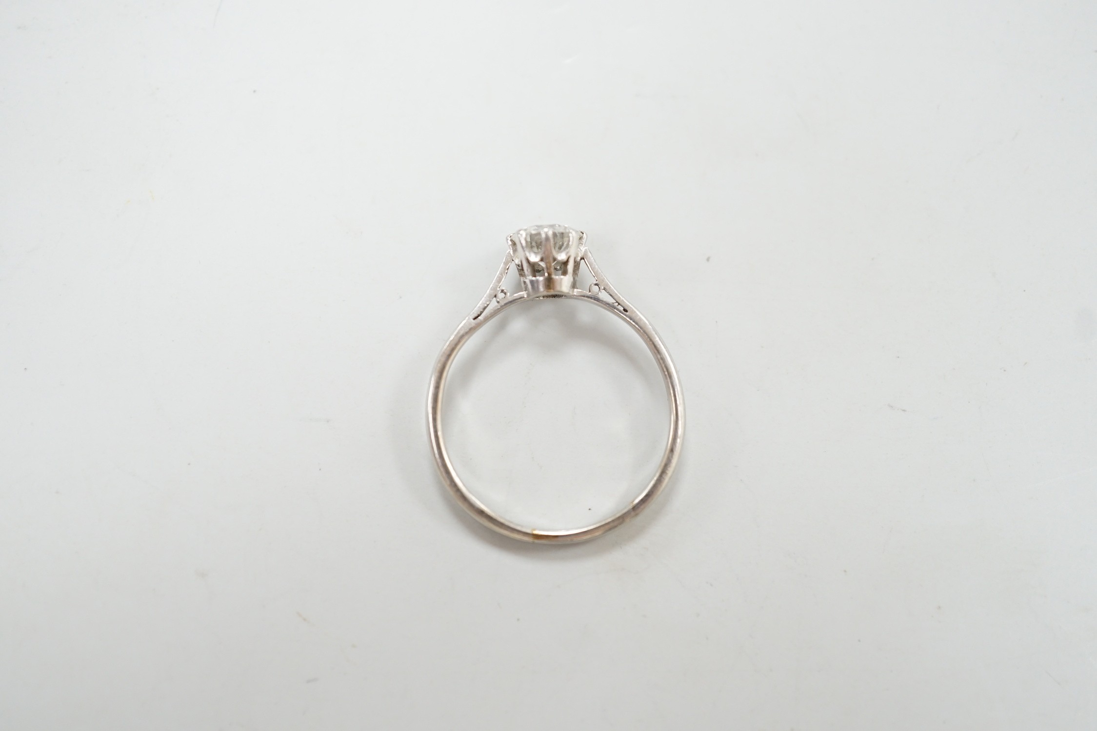 A white metal (stamped plat) and solitaire diamond ring, size P, gross weight 2.9 grams
